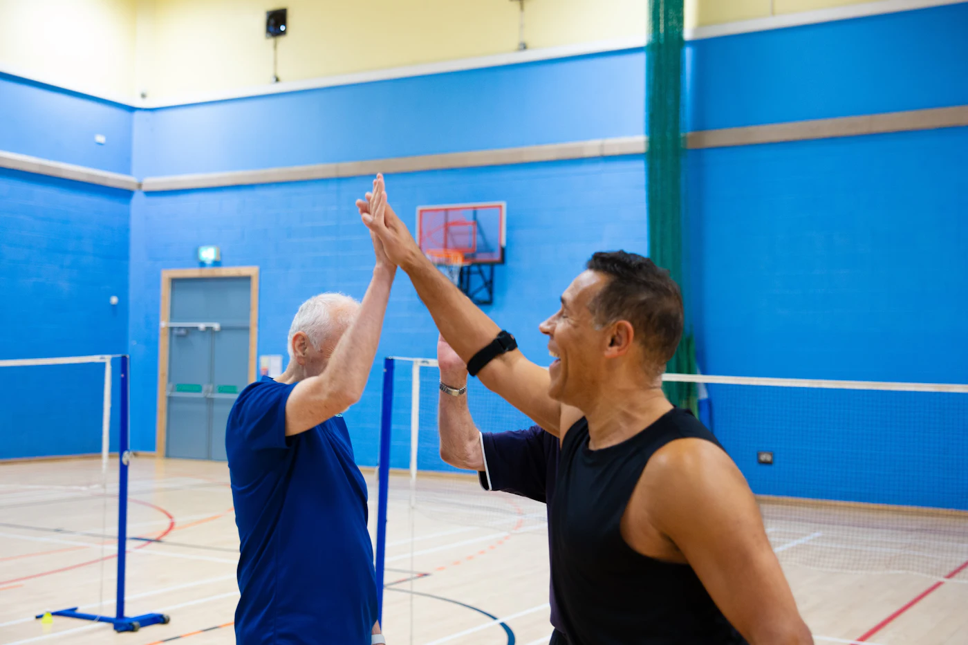 Dev high-fiving a member after a set